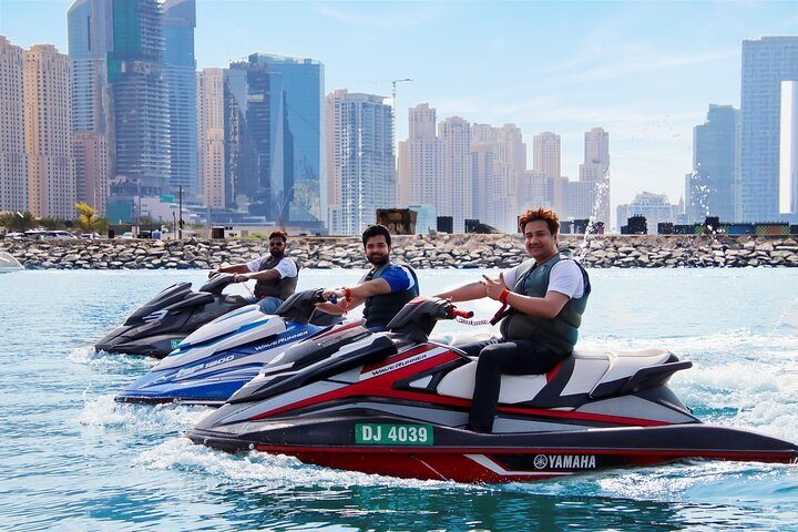 Experience the stunning skyline of Dubai as you zoom across the water on a jet ski capturing memories against a backdrop of iconic landmarks and exhilarating ocean views.